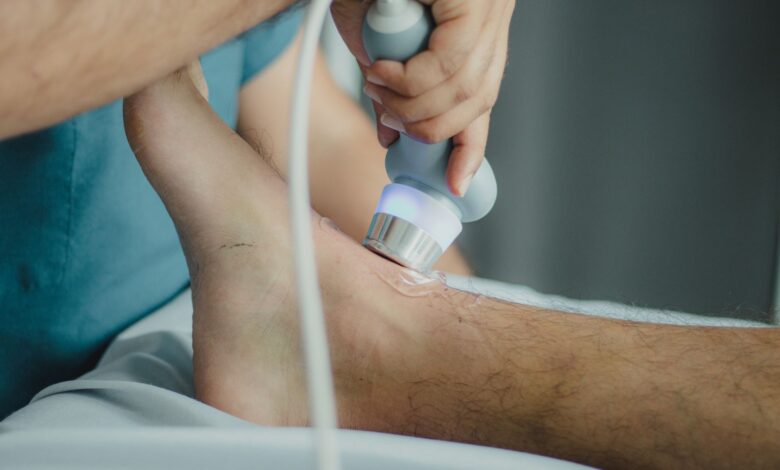 A physical therapist working with a patient in a modern outpatient clinic