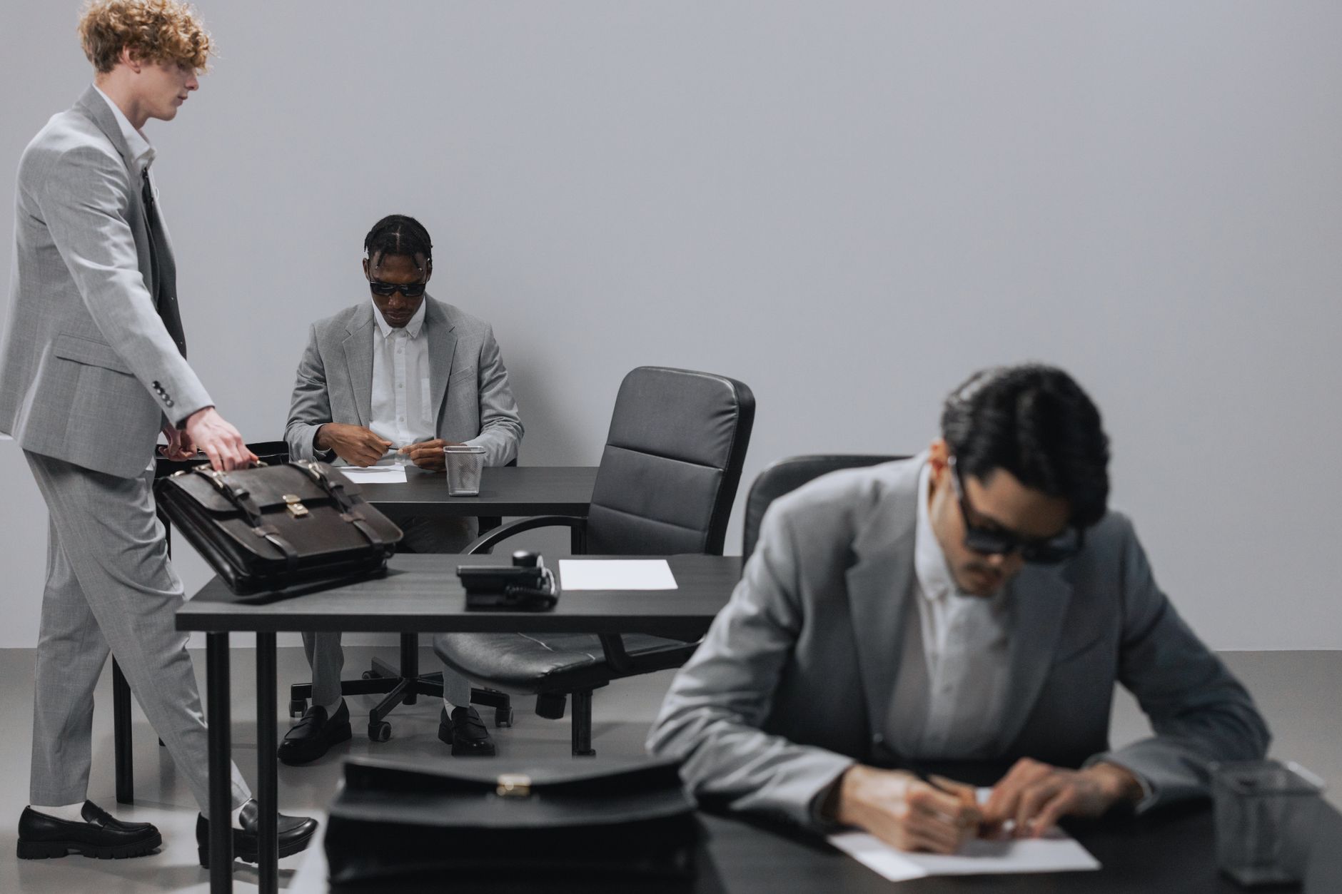 Professionals in a meeting room discussing an acquisition deal