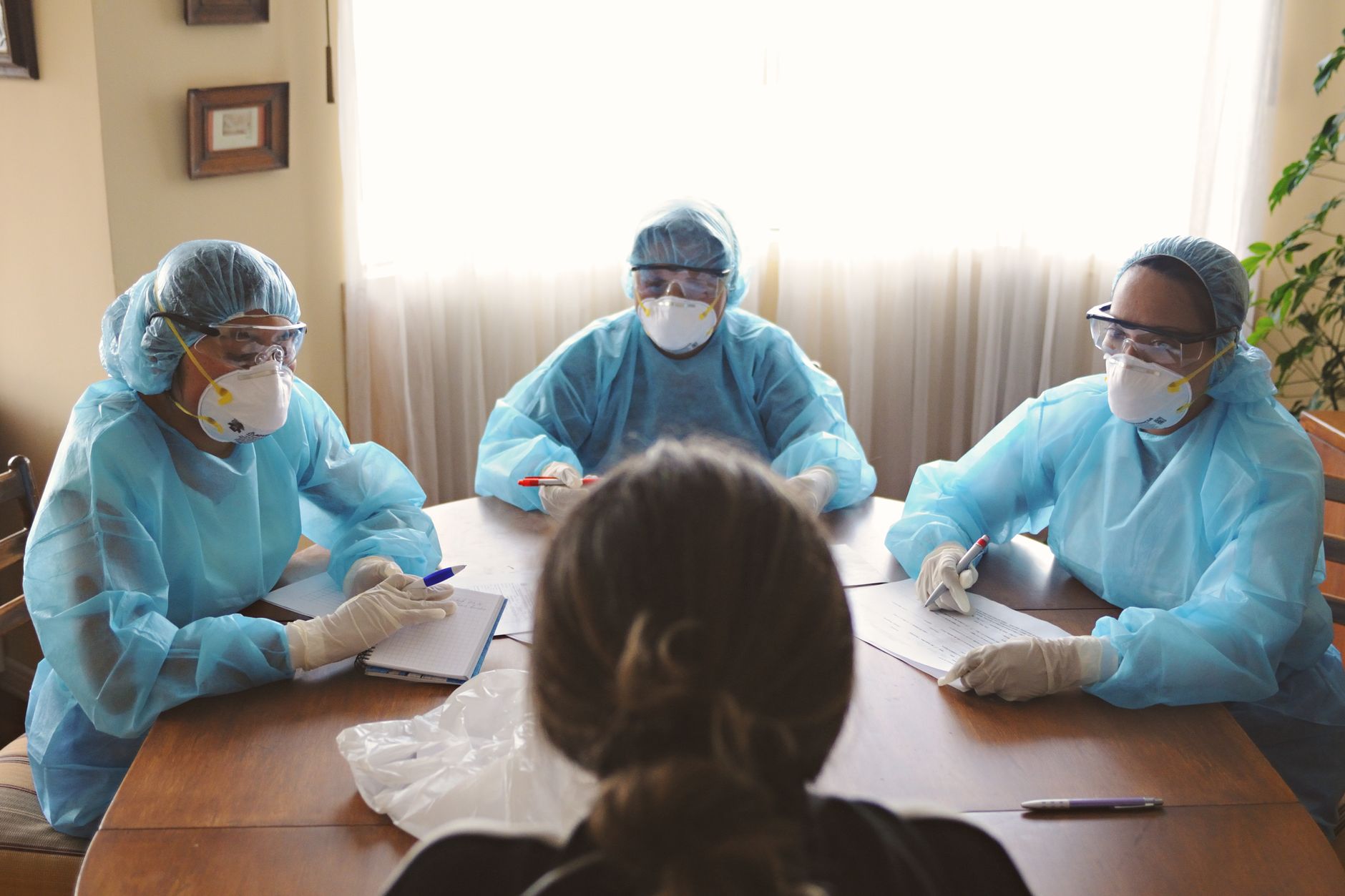 Physicians in a clinical meeting discussing infectious disease management