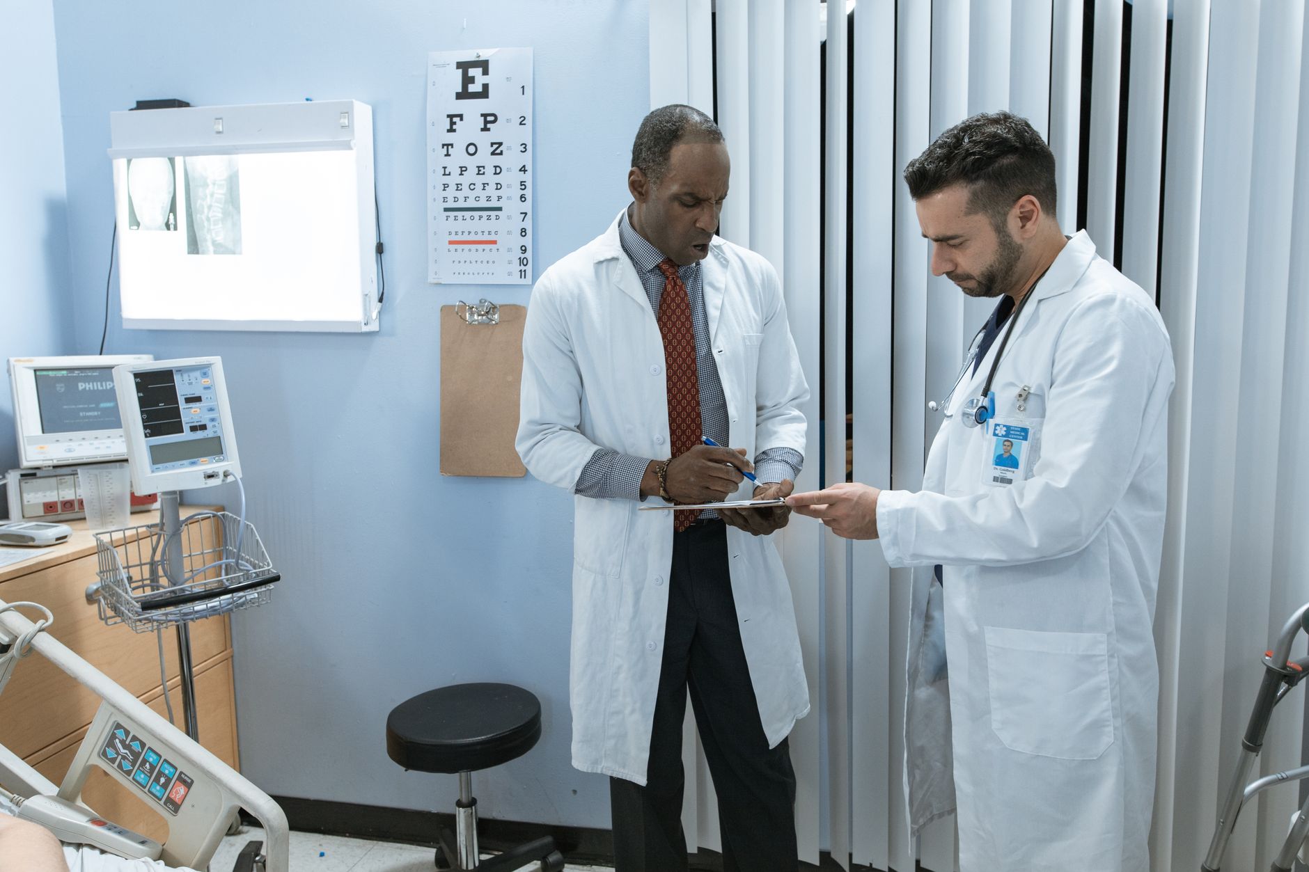 Hospital administrators reviewing documents in a conference room