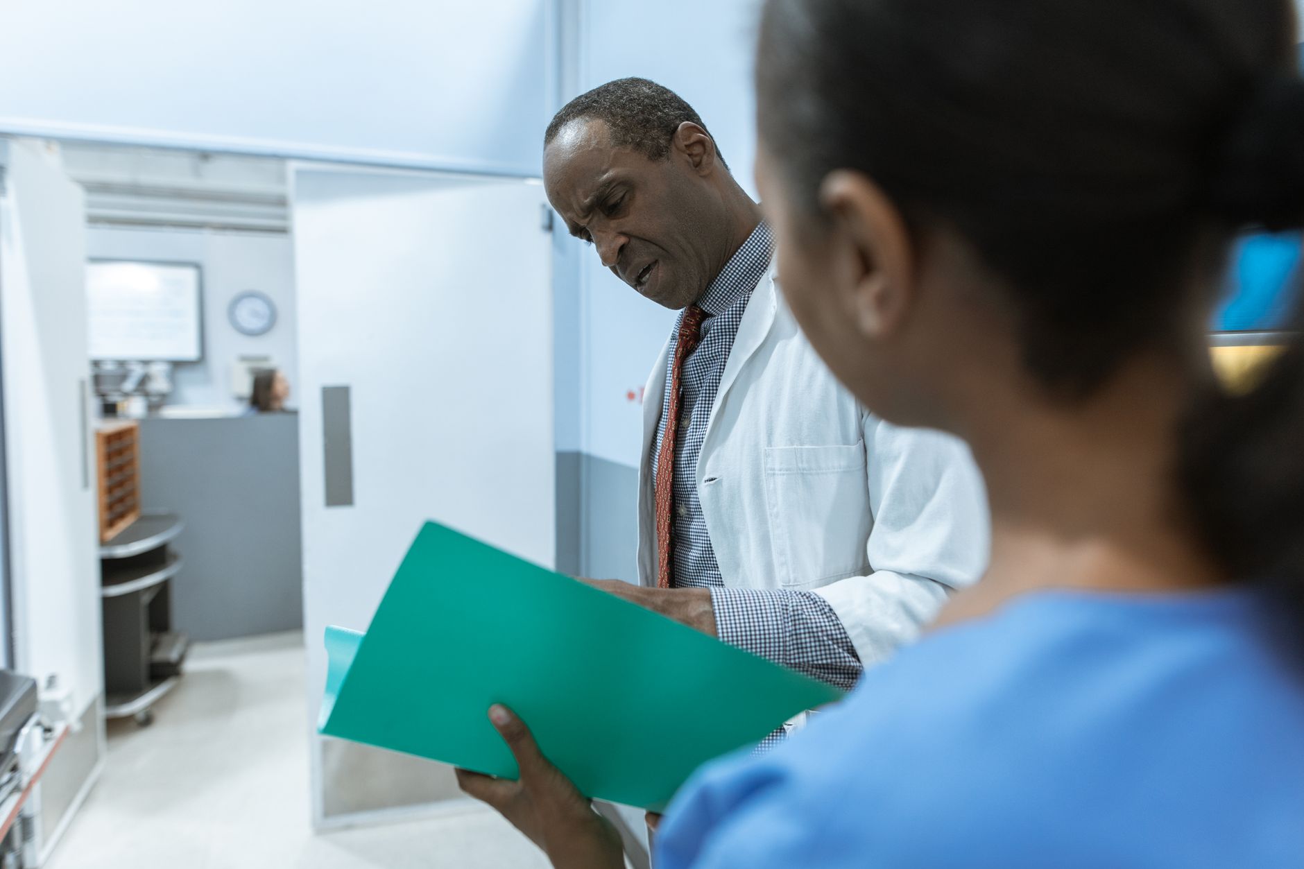 Healthcare professionals reviewing documents in a business meeting setting