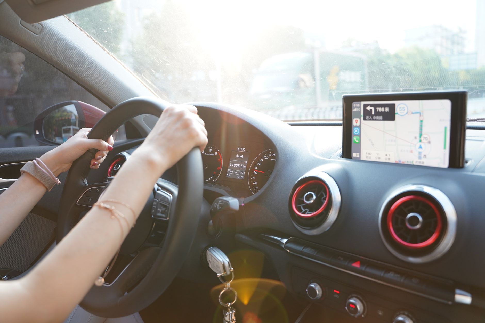 Person using a laptop to browse an online vehicle marketplace
