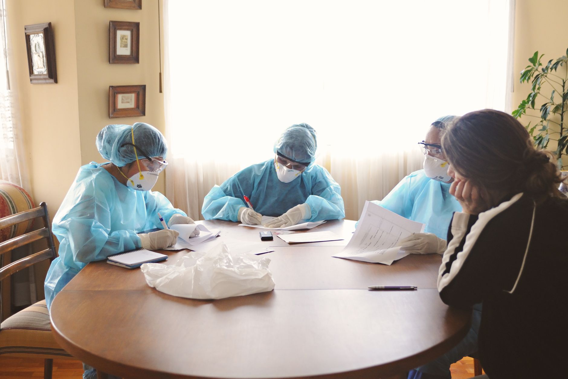 Healthcare administrators reviewing documents in a modern hospital conference room