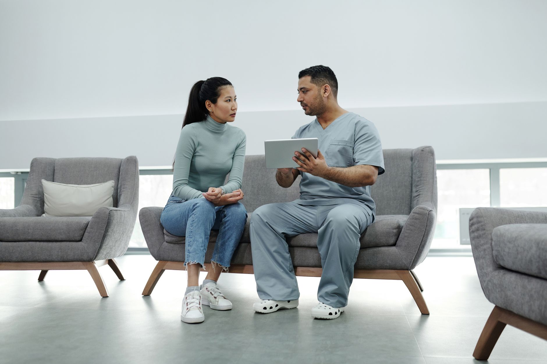 Healthcare professionals reviewing documents in a clinical setting