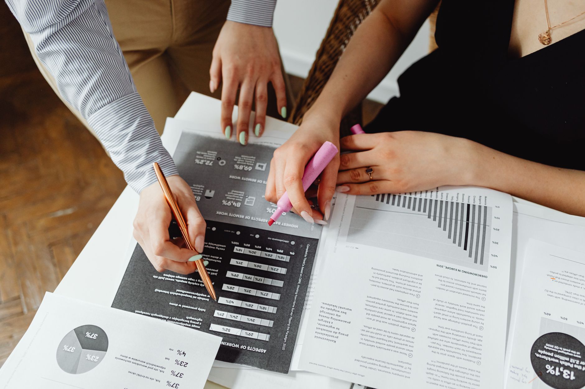 Business professionals reviewing financial documents at a conference table