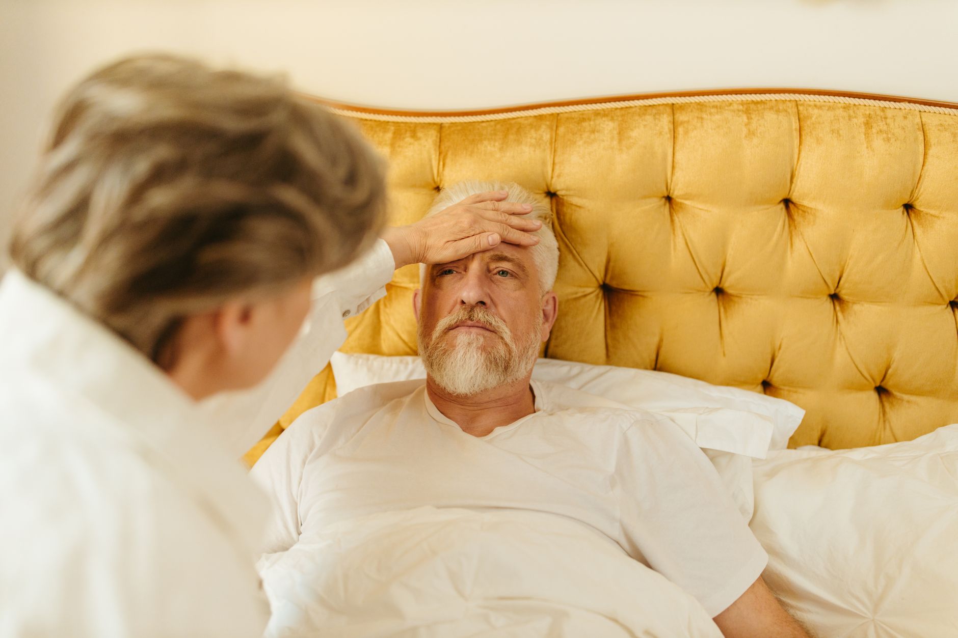 A caregiver assisting an elderly patient in a long-term care setting