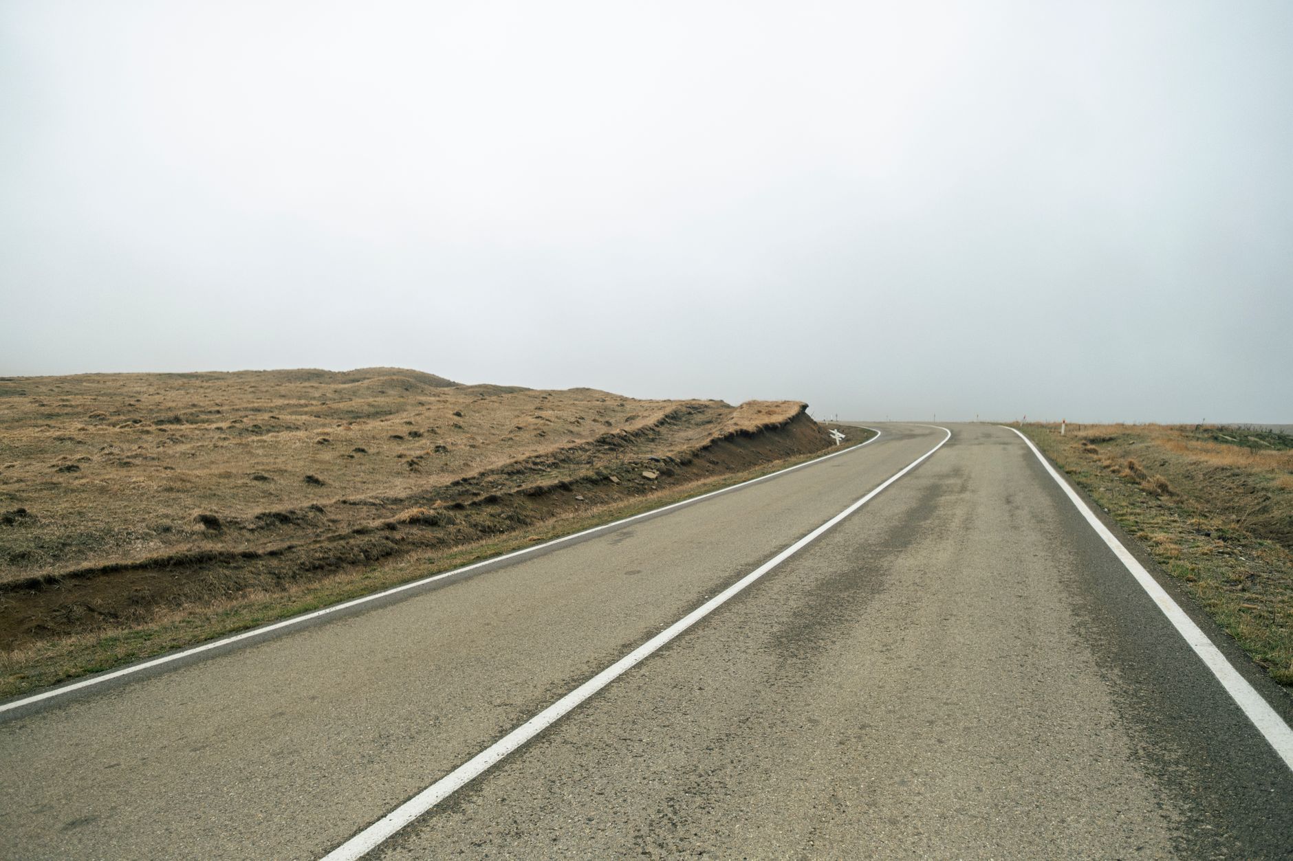 An empty rural road representing remote communities dependent on local EMS services
