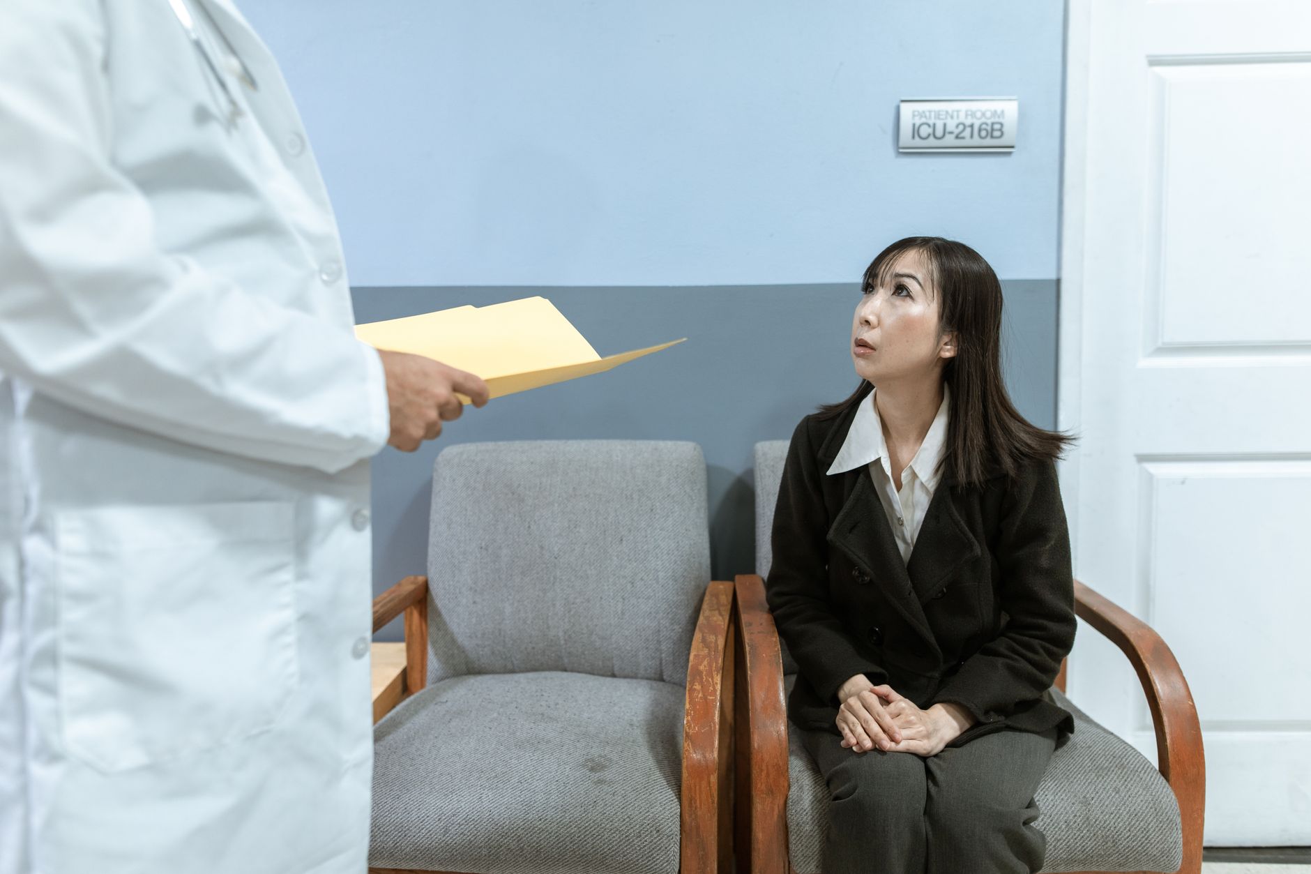 Patients seated in a modern medical clinic waiting room