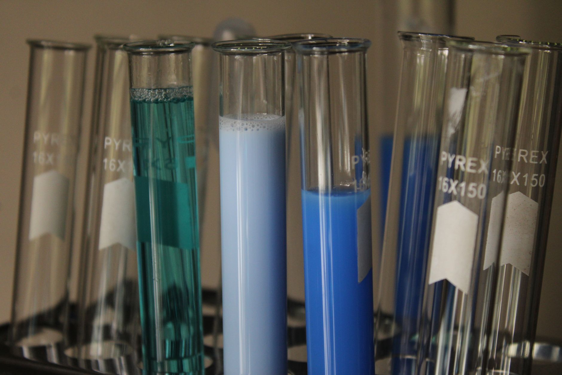 Technician collecting and analyzing water samples for environmental compliance testing