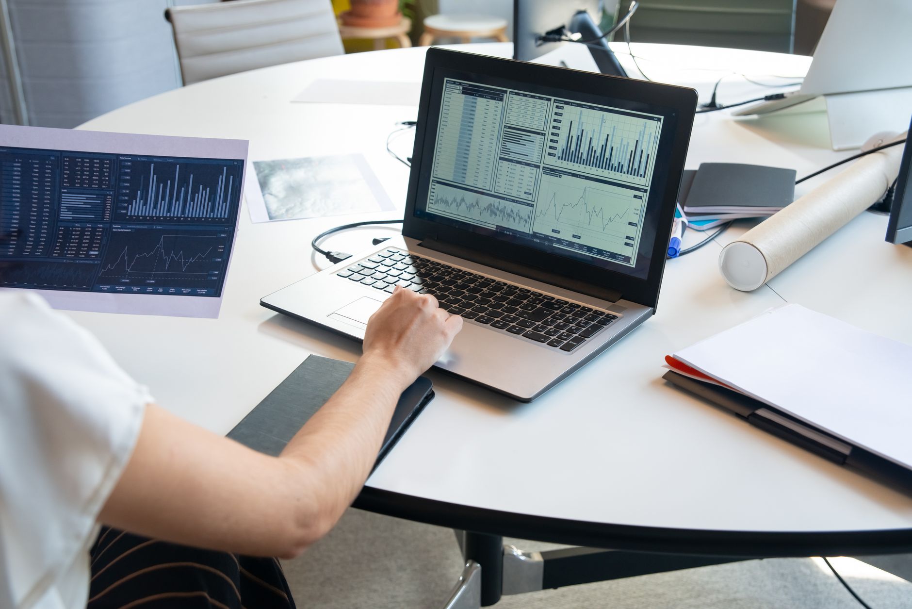 A person reviewing freight data on a laptop, representing digital loadboard technology