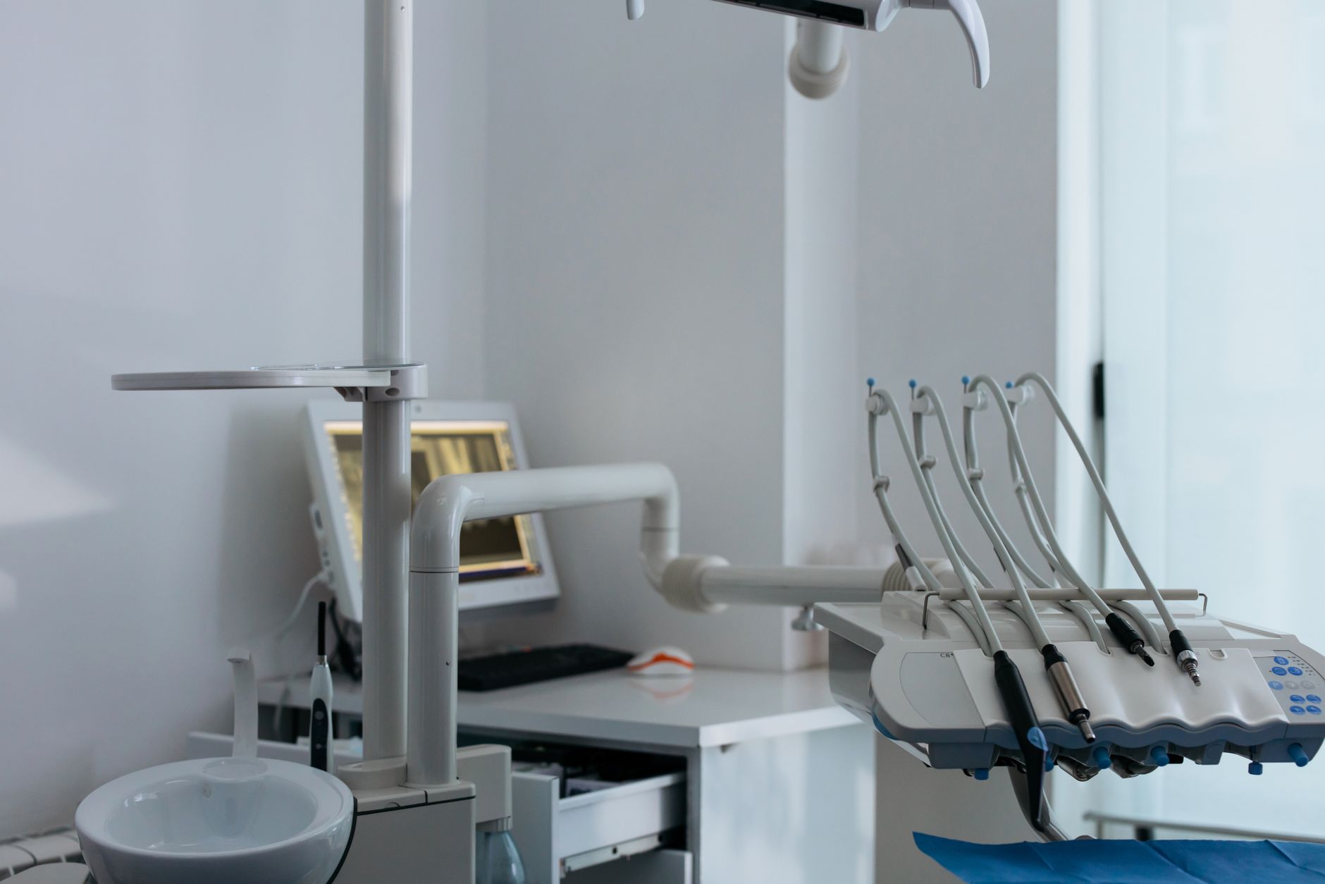 Interior of a modern dental clinic showing treatment chairs and equipment