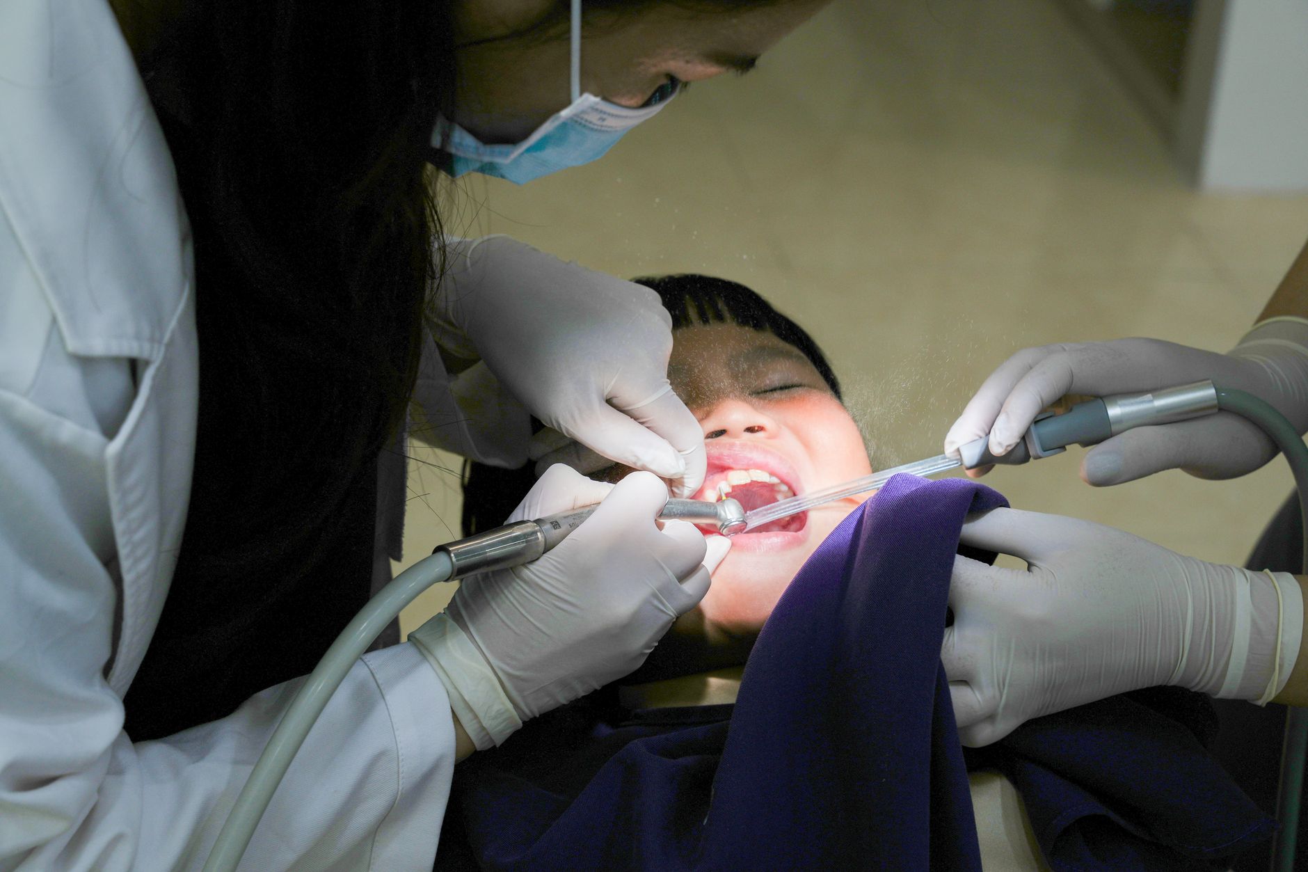 Young child sitting in a dental chair during a routine checkup