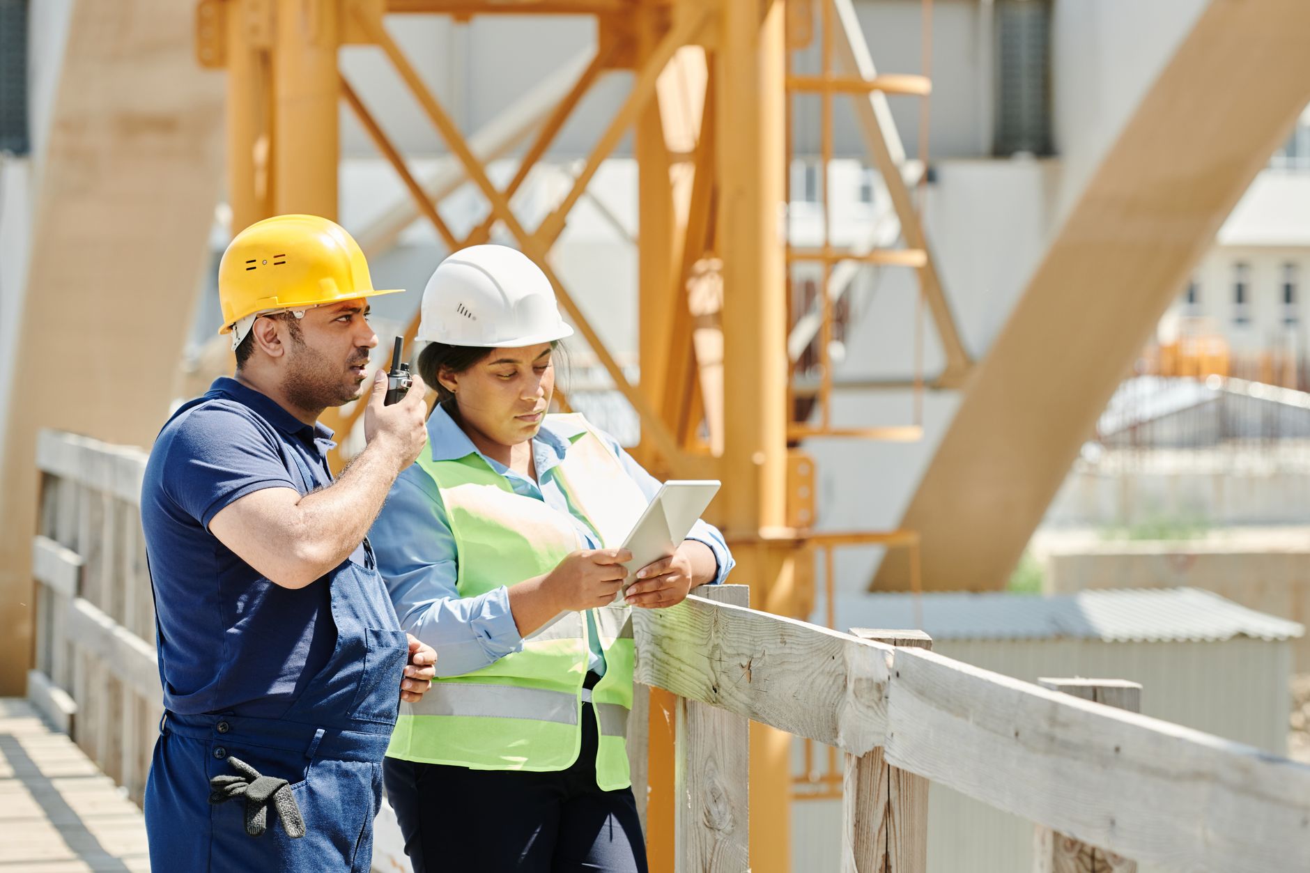A team of trade workers standing outside a commercial job site