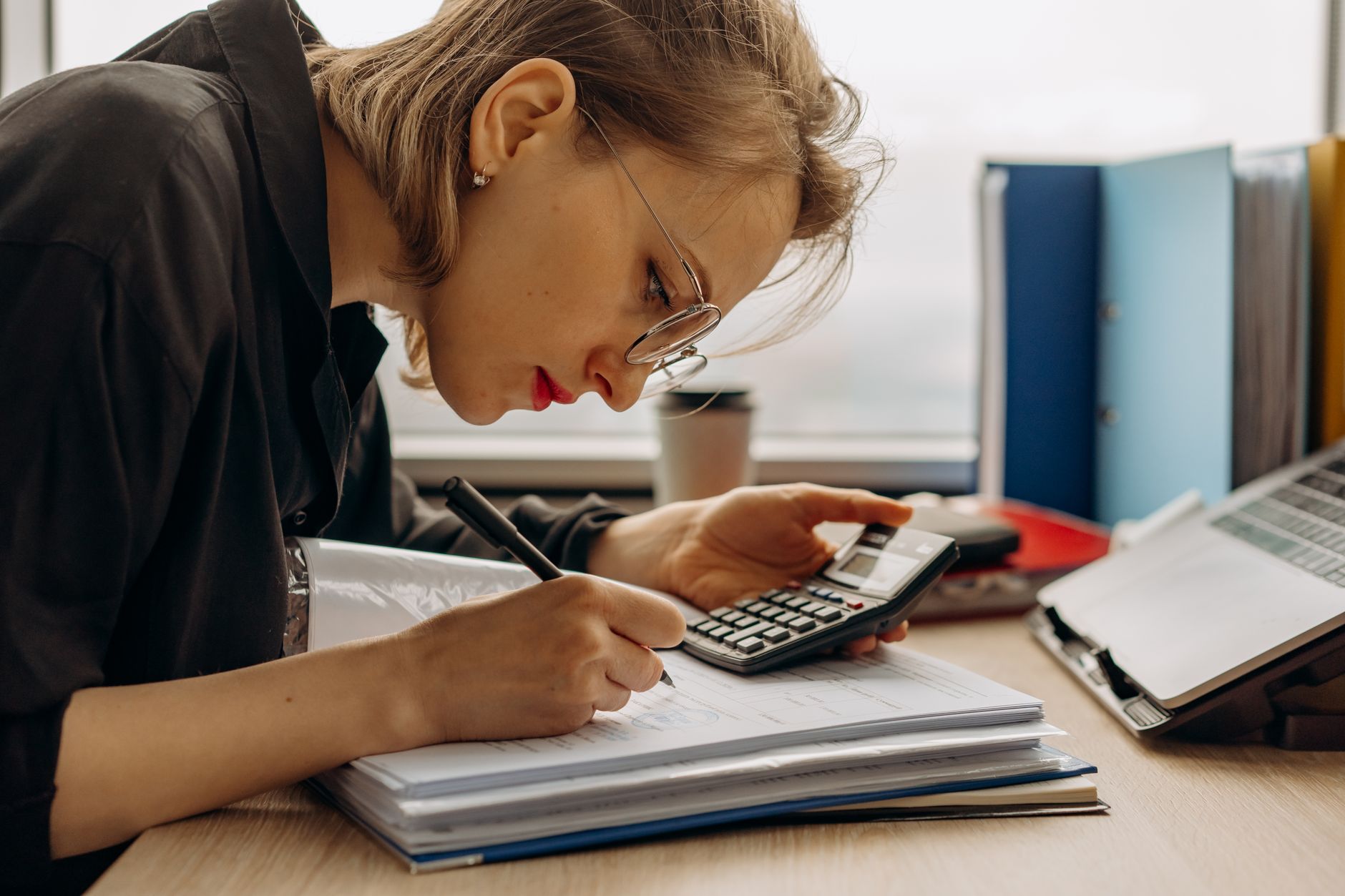 Accountant working at a desk in a regional CPA firm office