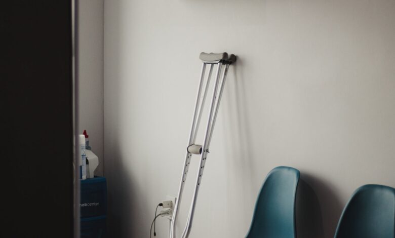 Empty fertility clinic waiting room with soft lighting and chairs