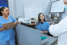 Healthcare staffing professionals reviewing documents in an office setting