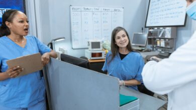 Healthcare staffing professionals reviewing documents in an office setting
