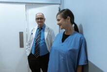 Empty hallway inside a medical office building representing a gastroenterology practice setting