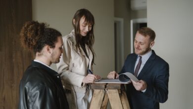 Title insurance documents and property paperwork spread across a desk