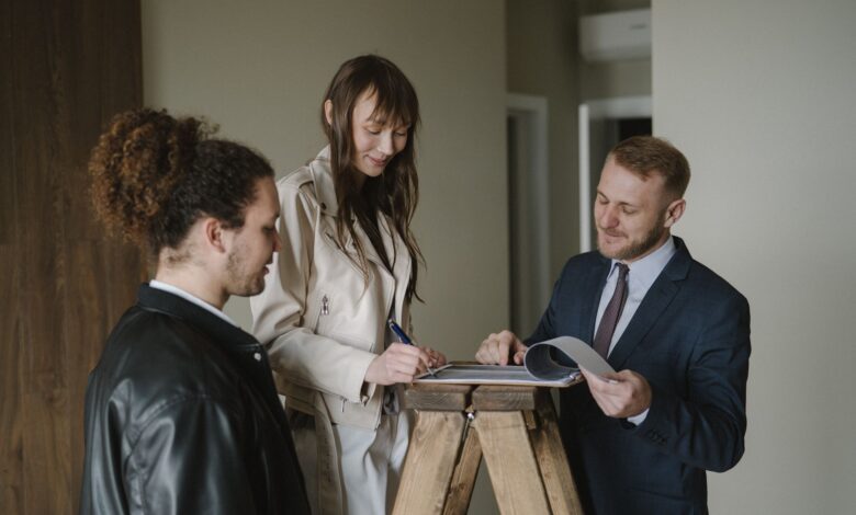 Title insurance documents and property paperwork spread across a desk