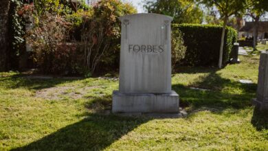 Exterior of a traditional funeral home building with a quiet street in front