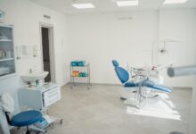 A modern dental or oral surgery office reception area with clean white interior