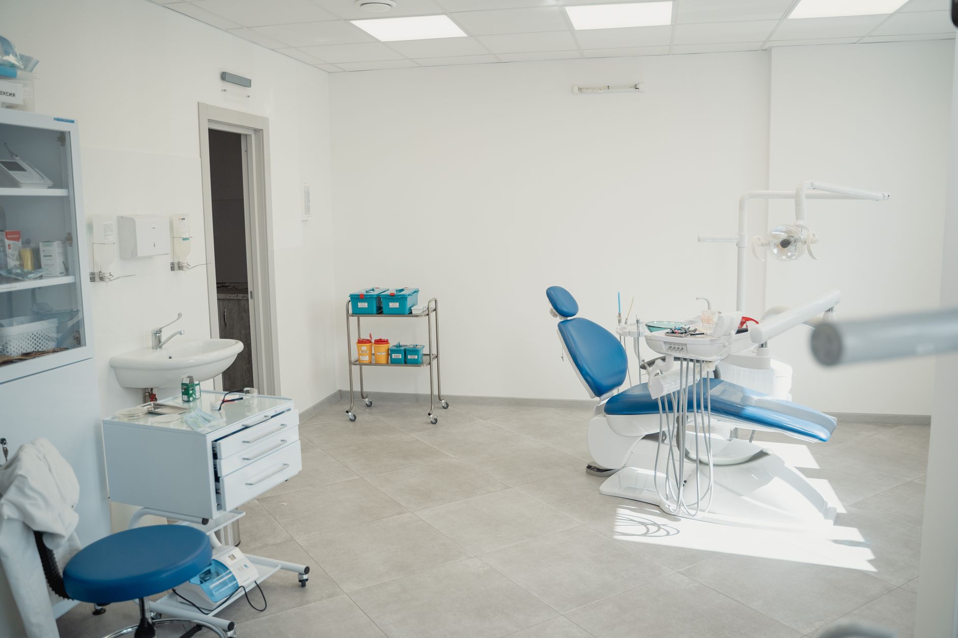 A modern dental or oral surgery office reception area with clean white interior