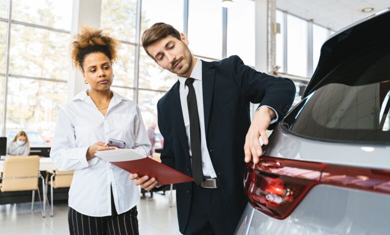 Interior of a modern car dealership showroom with vehicles on display