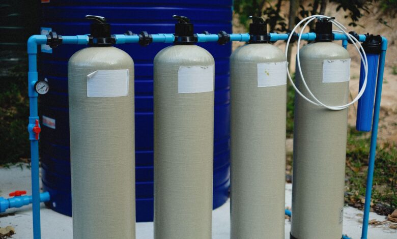Aerial view of a water treatment facility with circular filtration tanks