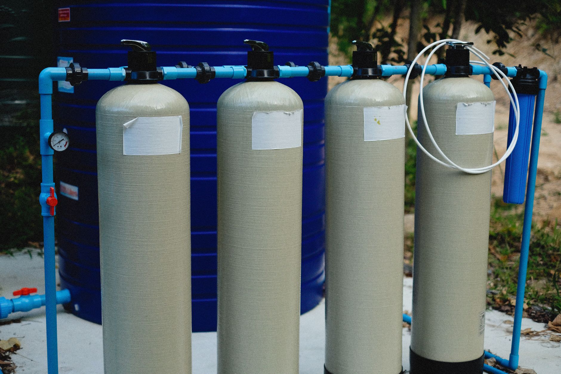 Aerial view of a water treatment facility with circular filtration tanks