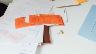 Mortgage documents and paperwork laid out on a desk representing a home loan servicing transaction