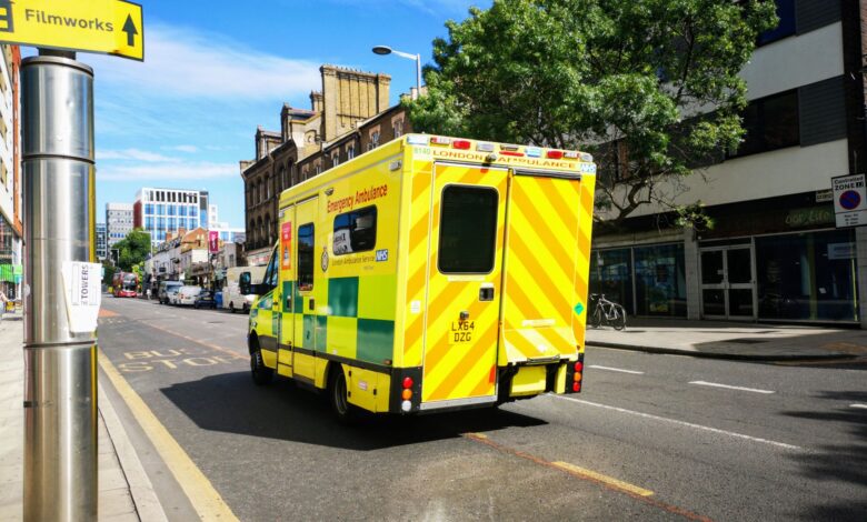 Ambulance driving through a city street representing regional emergency medical services