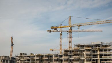 Large construction crane on an industrial worksite against a clear sky