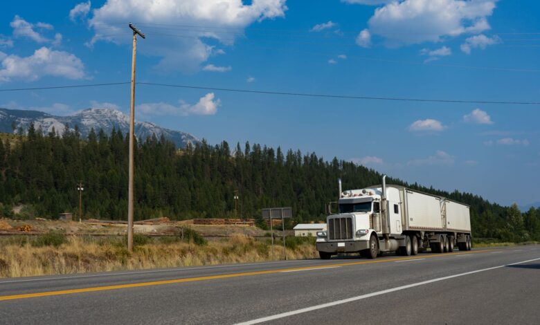 Semi truck driving on a highway representing regional freight transportation