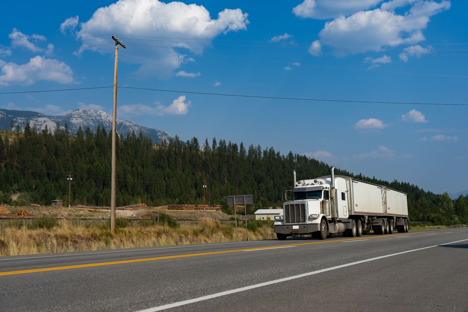 Semi truck driving on a highway representing regional freight transportation