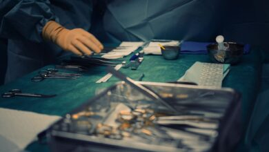 Empty operating room with anesthesia equipment and surgical lighting