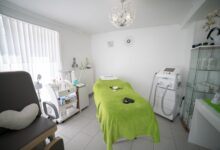 Interior of a small occupational therapy clinic with treatment tables and equipment