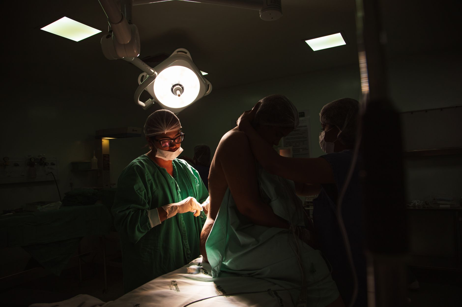 Surgeons performing an orthopedic procedure in a modern operating room