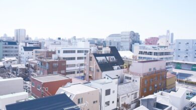 Workers on a flat commercial rooftop during a roofing project