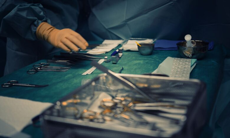 Surgeons performing an orthopedic procedure in a modern operating room