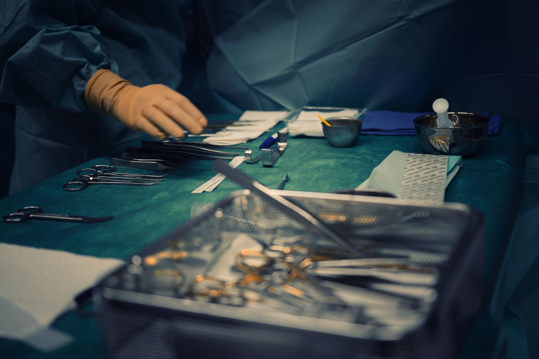 Surgeons performing an orthopedic procedure in a modern operating room