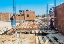 Roofing contractors working on a residential roof installation