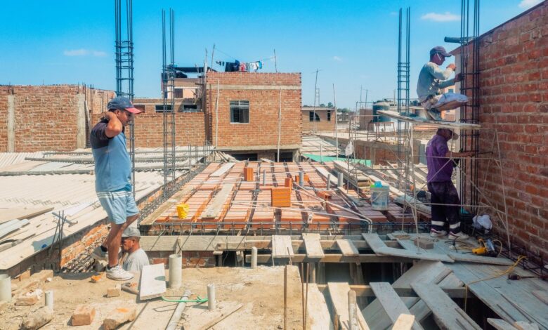 Roofing contractors working on a residential roof installation