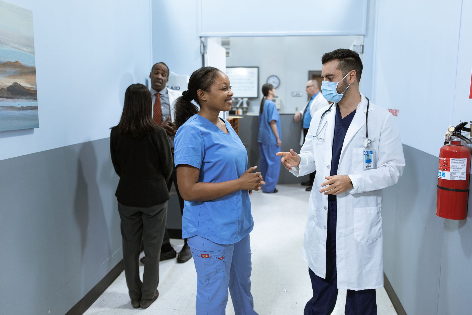 Healthcare staff walking through a modern hospital corridor