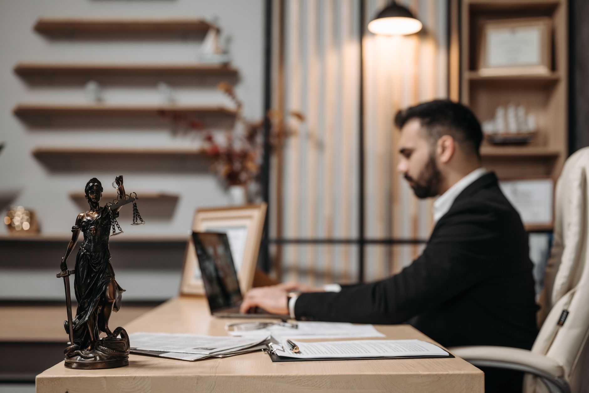 Regional law office with attorney working at a desk