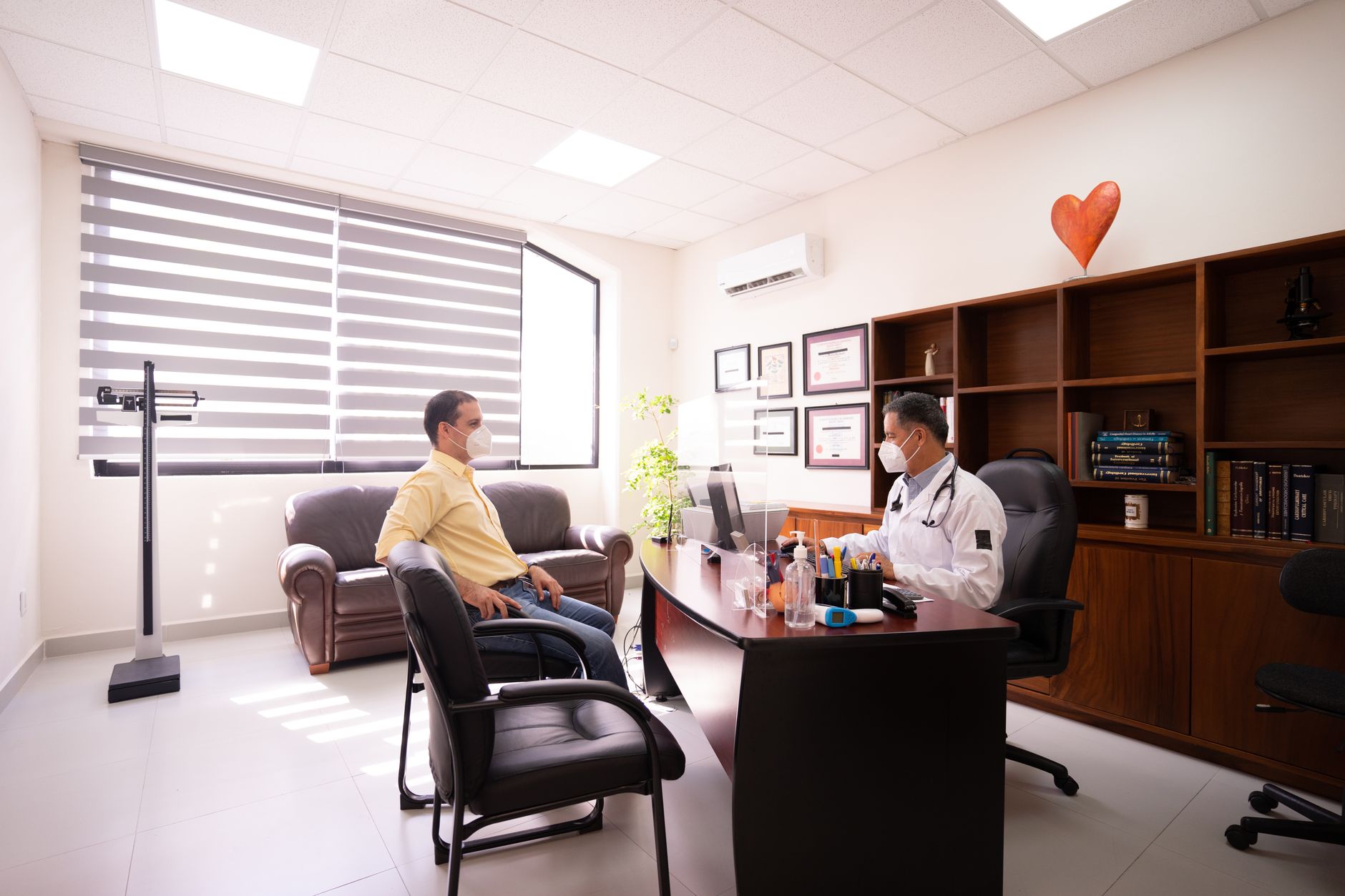 A physician consulting with a patient in a private practice examination room