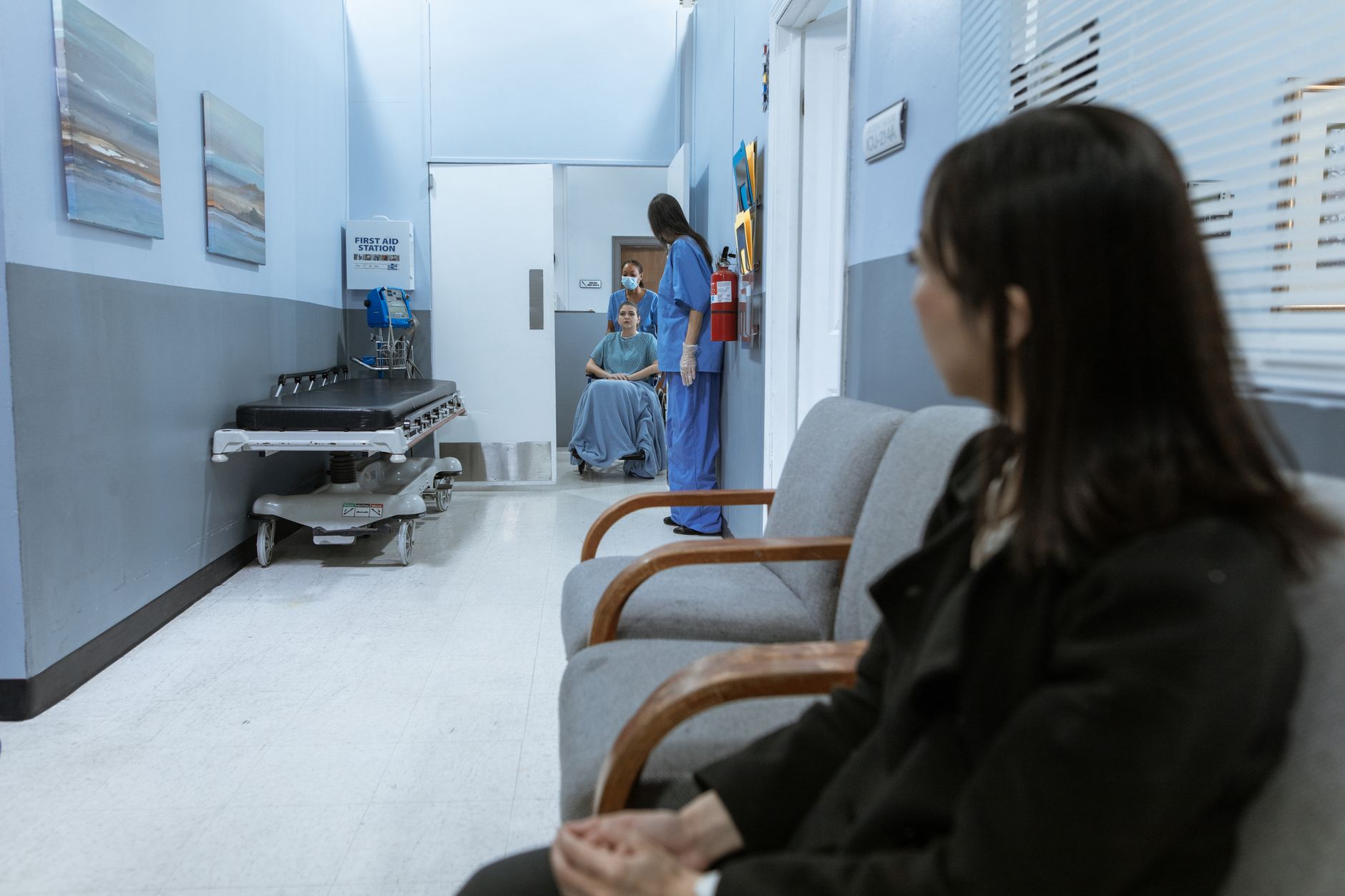 Hallway inside a skilled nursing facility with medical equipment along the wall