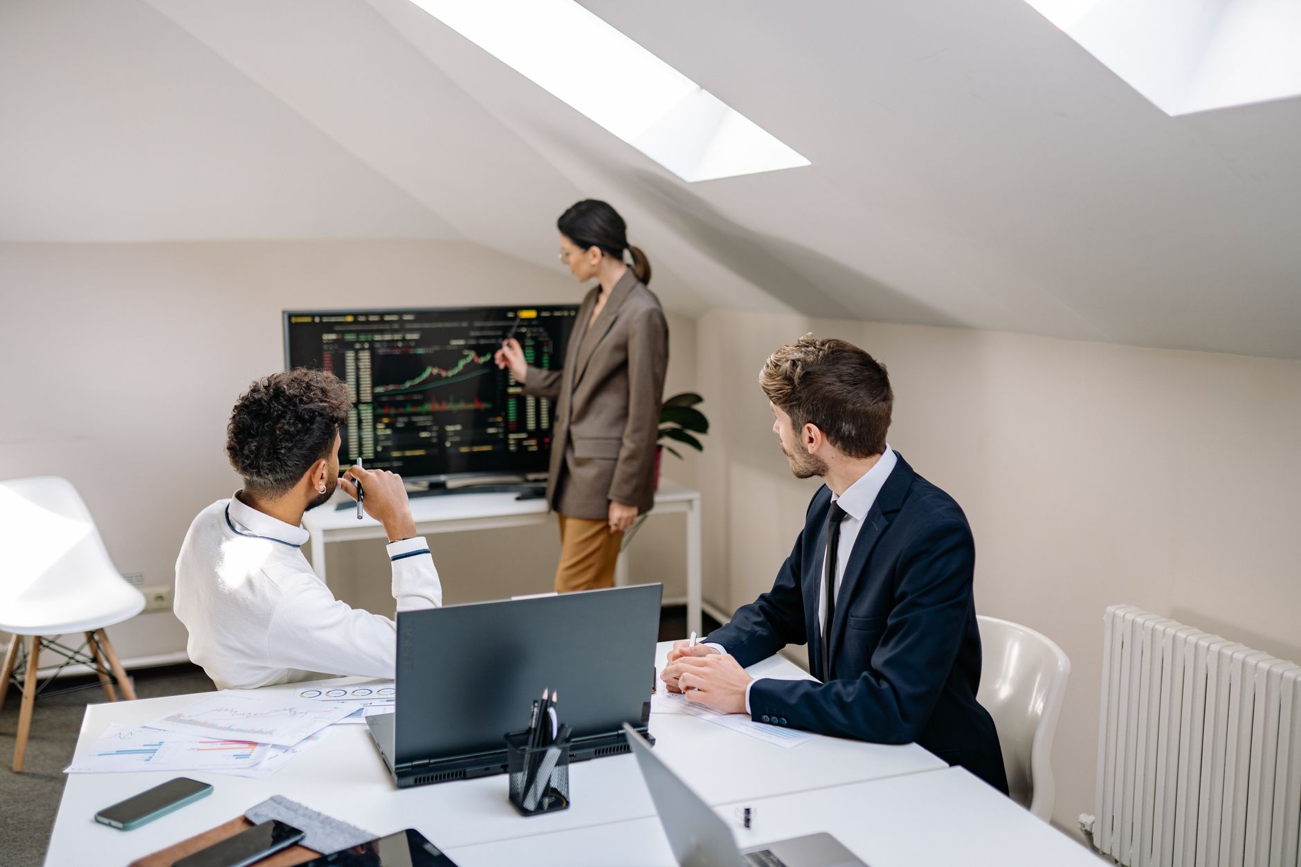 Business professionals reviewing financial documents in a modern office setting