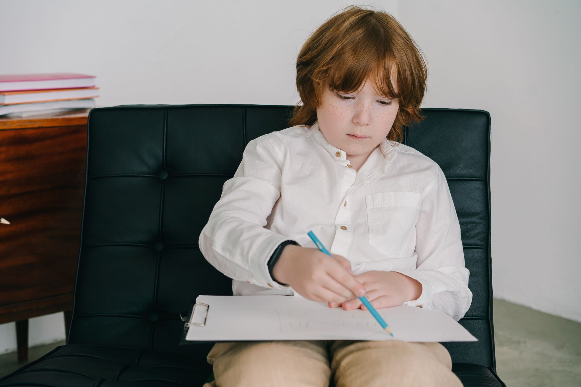 A speech-language pathologist working with a young child during a therapy session