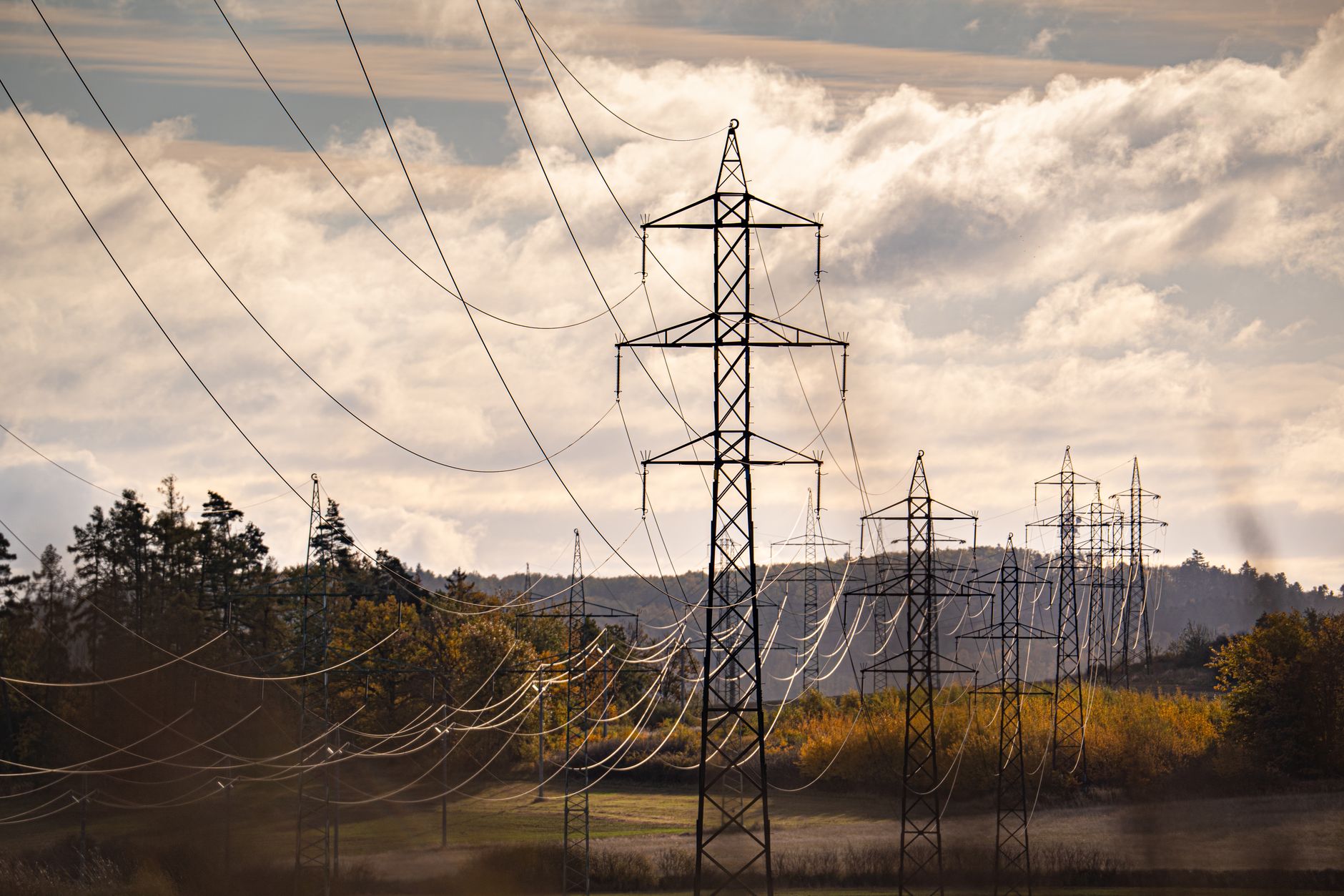 Aerial view of electrical power grid transmission lines and infrastructure